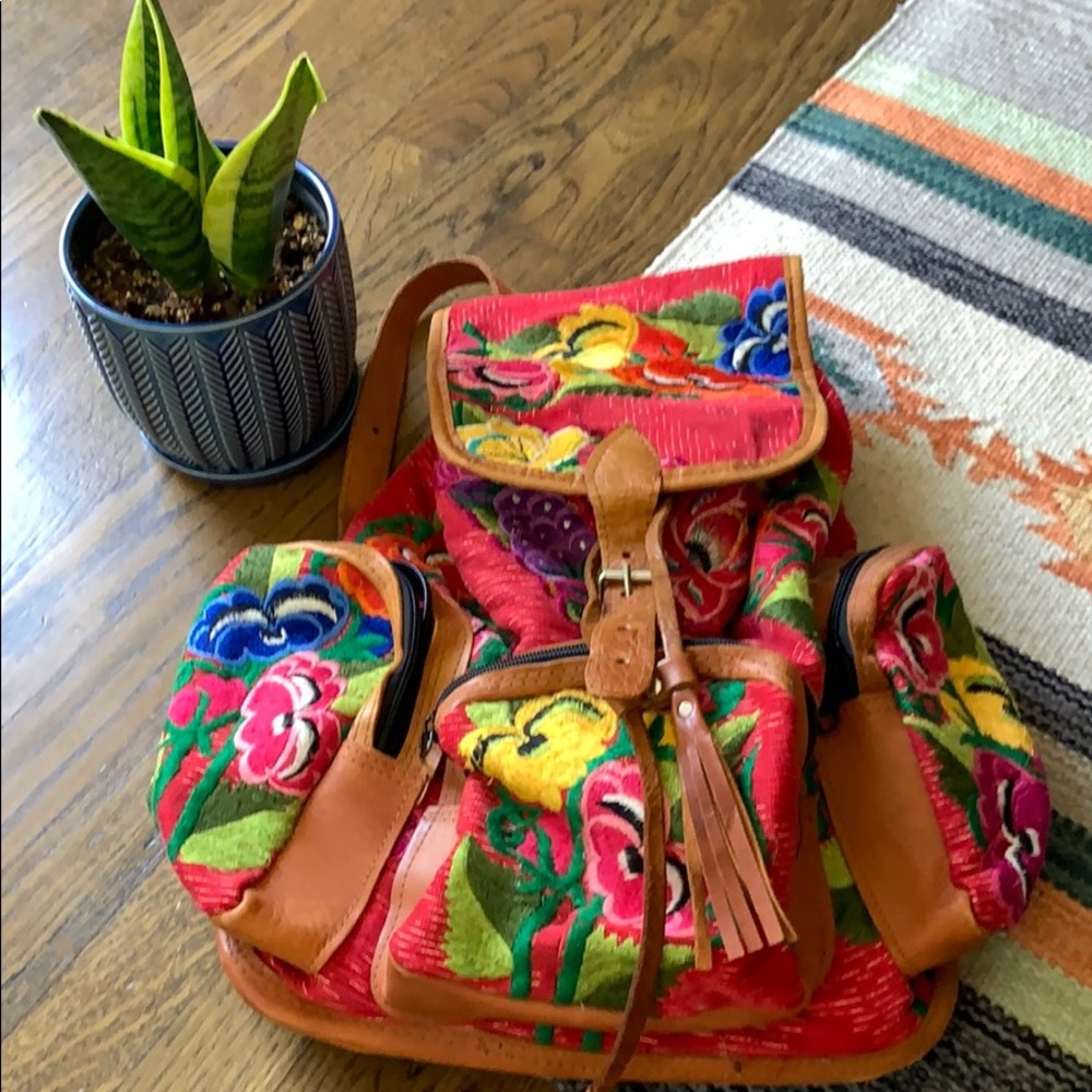 Beautiful patterned backpack with leather trim.